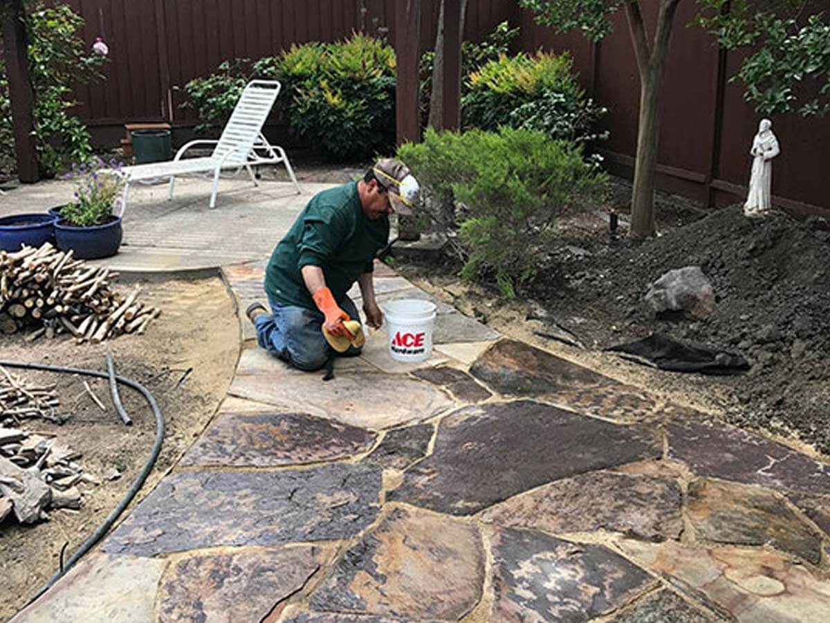 after a pool removal, one of our pros is working on a hardscape